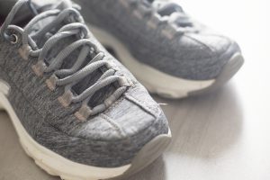 sneakers on grey tile