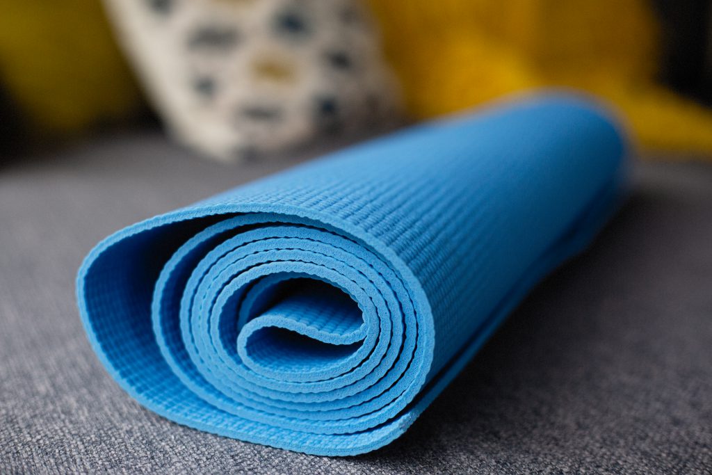 Blue Yoga Mat on a Couch