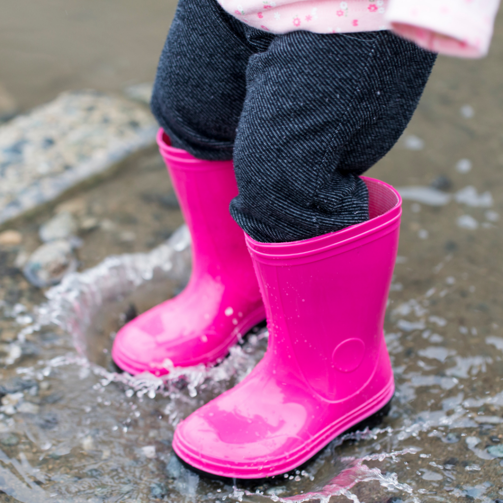 image of gumboots in puddle