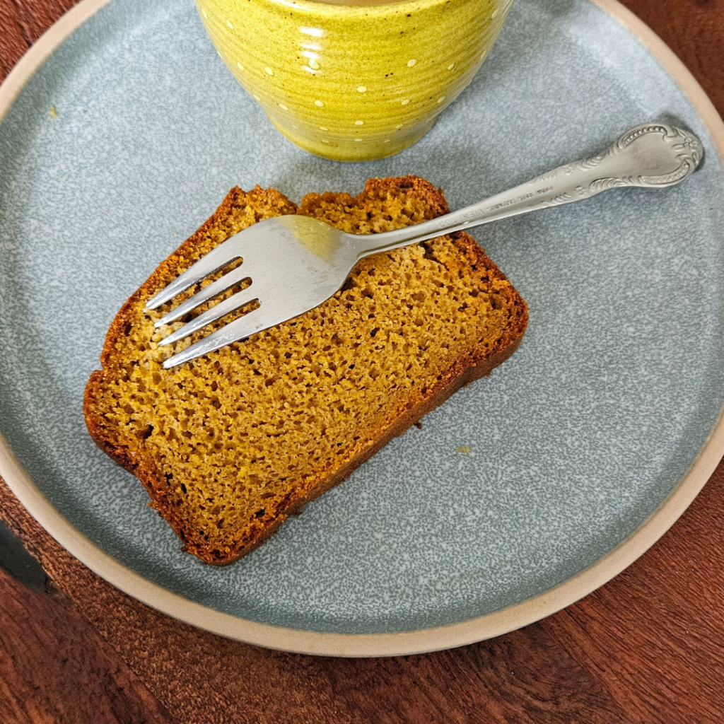 a piece of gingerbread with a fork on a plate comforting winter recipe